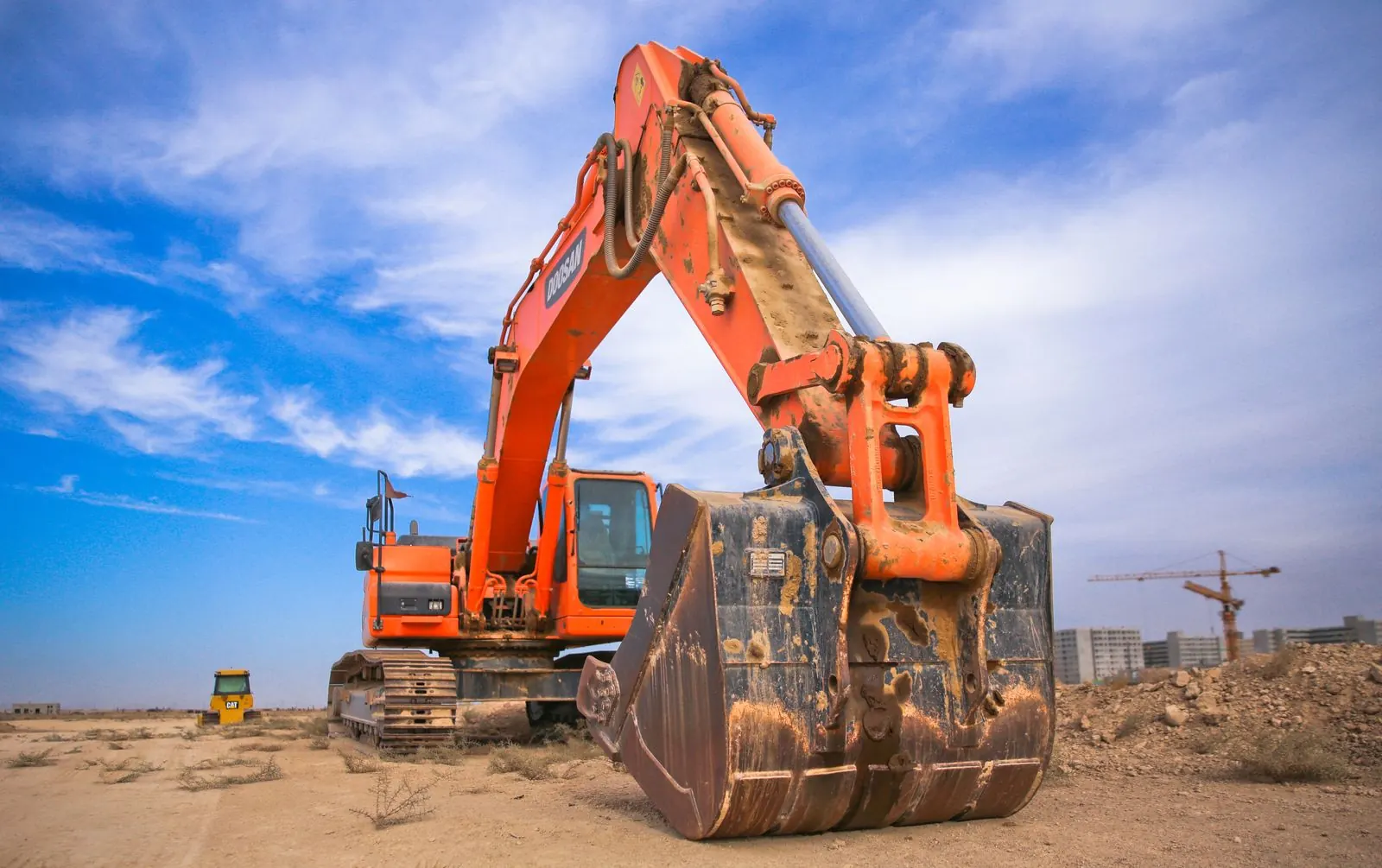 Yellow construction equipment on a South African worksite